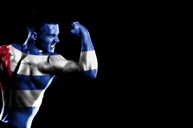 Cuba flag on handsome young muscular man black background