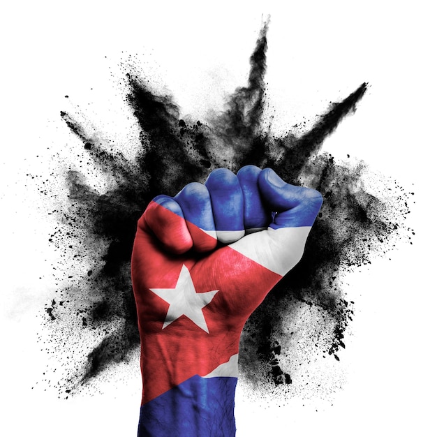 Photo cuba raised fist with powder explosion power protest concept