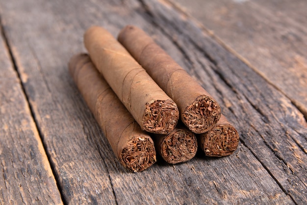 Cuban cigars on a wooden table