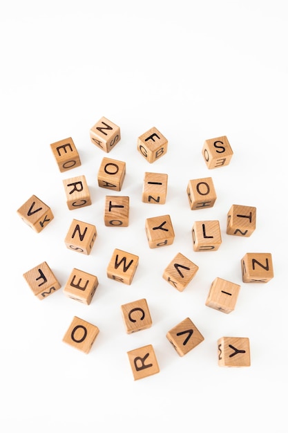 Photo cube letters on a wooden table as a background