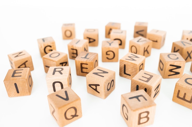 cube letters on a wooden table as a background