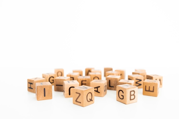 cube letters on a wooden table as a background