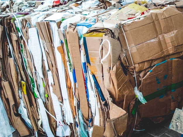 Cube of packed corrugated paper and newspaper ready to recycle