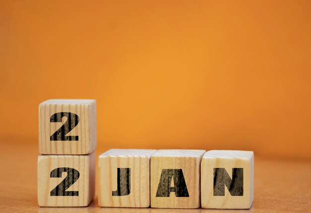 Cube shape calendar for January 22 on wooden surface with empty space for text new year Wooden calendar with date January cube calendar on wooden surface with copy space