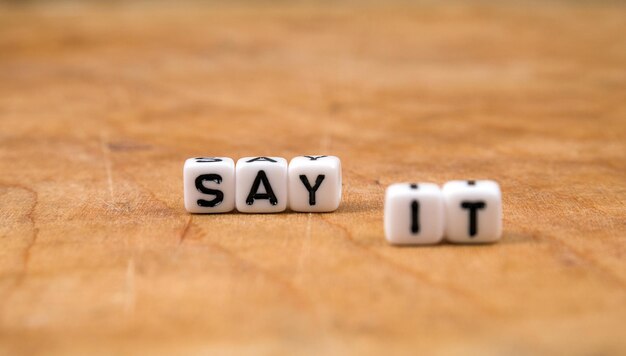 Photo cube words on the wooden table