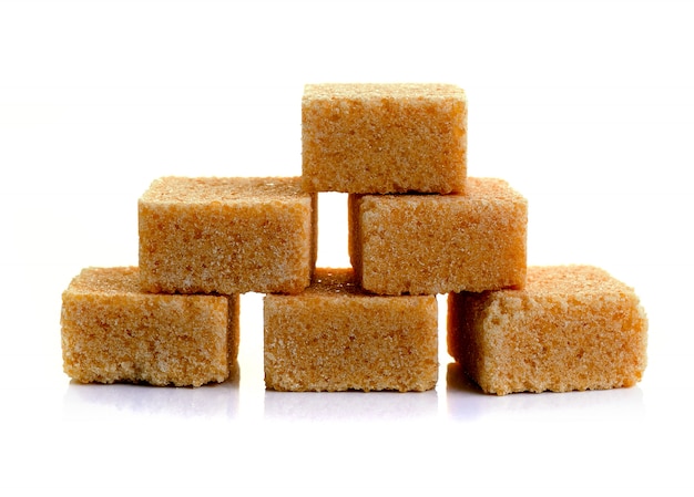 Cubes of cane sugar isolated on white background