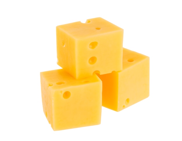 Cubes of cheese isolated on white background