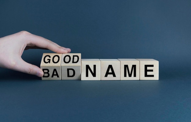 Cubes form the words Bad name or good name Reputation concept in business