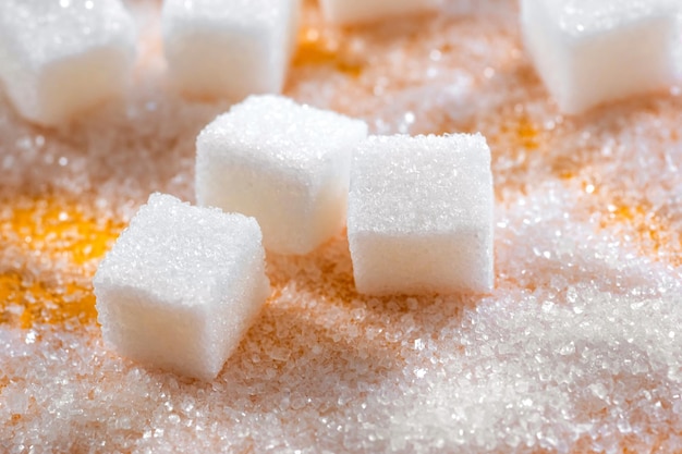 Cubes of refined sugar on the table closeup