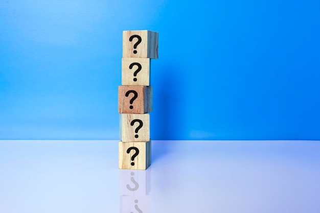 Cubes with question marks with reflection on white background copy space