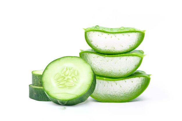 Cucumber and aloe vera slices isolated on white\
background.