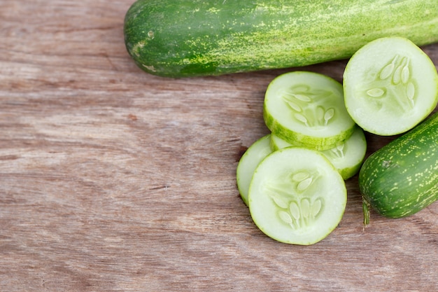cucumber isolated on wood background.