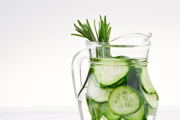 Cucumber and Rosemary Infused Water on wooden table