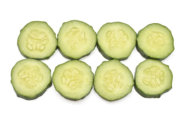 Cucumber slices isolated on white background Top view flat lay