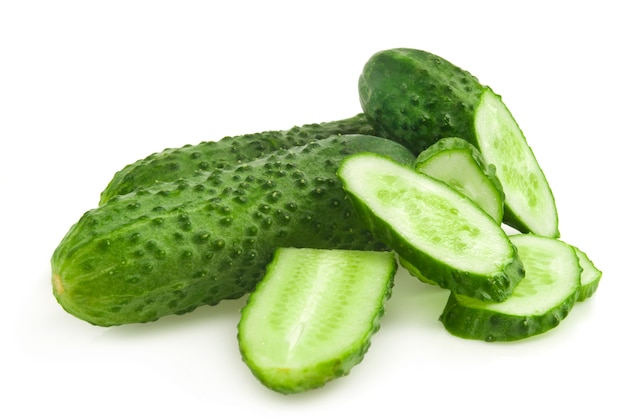 Cucumber and slices isolated over white 