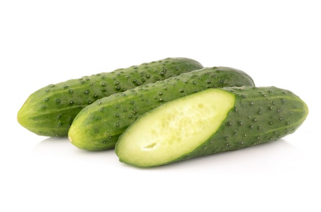 Cucumbers on a white surface isolated