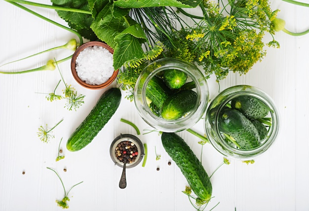 Cucumbers on white table, top view