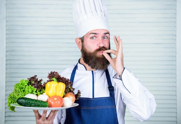 Cuisine culinary. Vitamin. Healthy food cooking. Mature hipster with beard. Dieting organic food. Vegetarian salad with fresh vegetables. Happy bearded man. chef recipe. Shopping day.