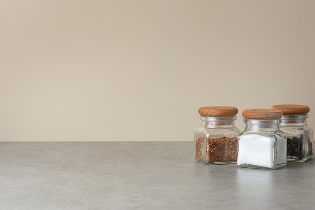 Culinary background with spices on a gray kitchen table side view