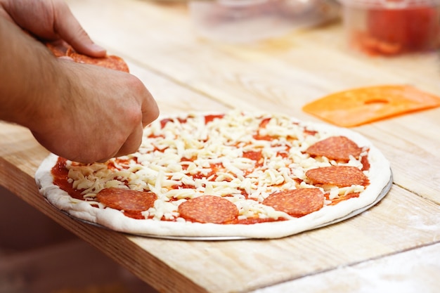 Culinary chef cooking  tomato pizza