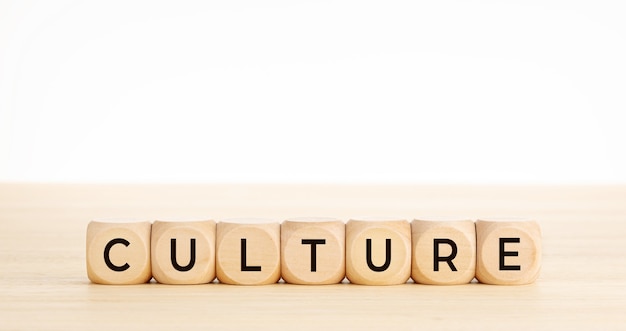 CULTURE word on wooden blocks on wood table. Copy space. 