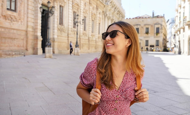 Culture and Young People. Pretty young woman visiting the baroque city of Lecce, Apulia, Italy.