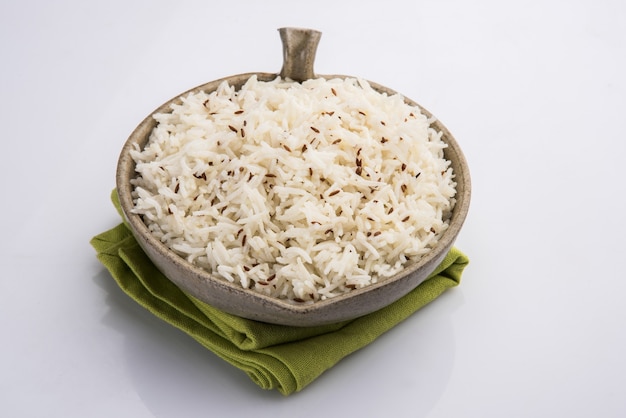 Cumin rice or Indian Jeera Rice on colourful background, selective focus