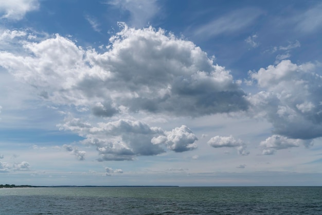 Cumulus clouds over the Baltic Sea on the coast of the resort town on a sunny summer day Zelenogradsk Kaliningrad region Russia