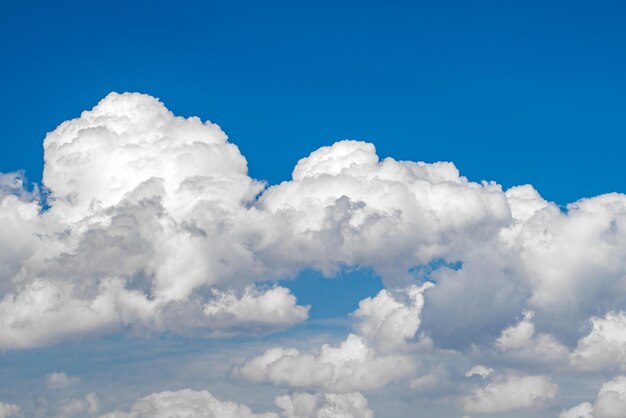 Cumulus clouds closeup on blue sky on clear day