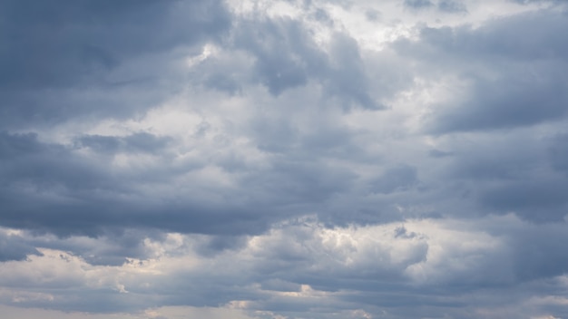 Cumulus clouds with blue sky on a sunny day of summer. Beautiful cloudscape as nature background panorama. Wonderful weather of natural daylight with white cloud floating, creating a abstract shape