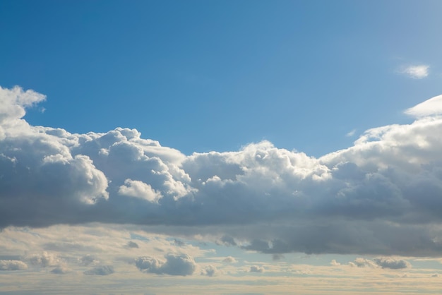 Cumulus clouds with blue sky on a sunny day of summer.
beautiful cloudscape as nature background panorama. wonderful
weather of natural daylight with white cloud floating, creating a
abstract shape