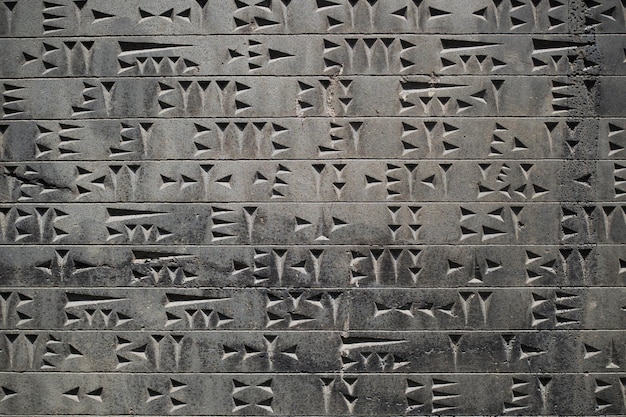 Cuneiform street monument dedicated to ancient writing relief stone slab