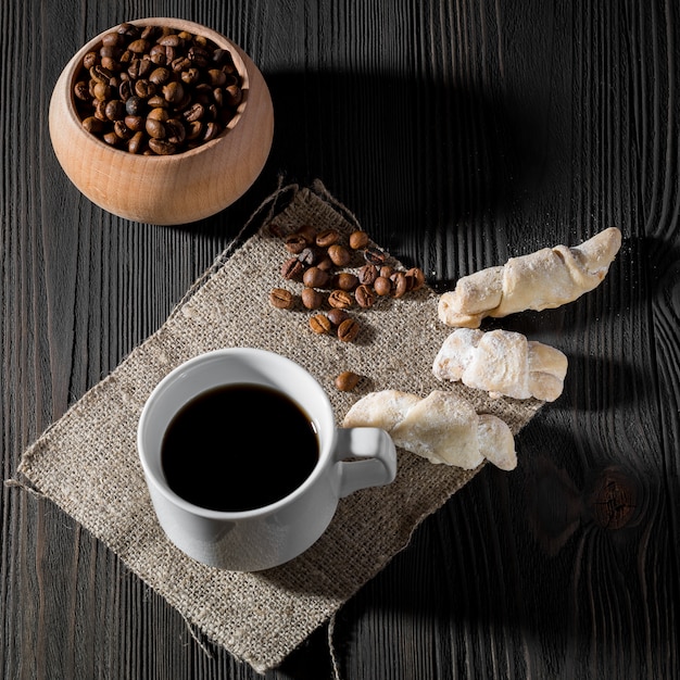 A cup of americano coffee on wood texture, still llife photography