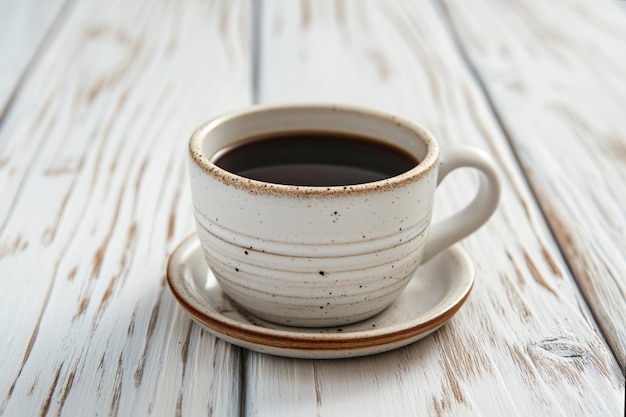 Cup of aromatic black coffee on a white rustic wooden background