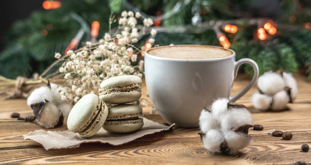 Cup of aromatic coffee and macaroons