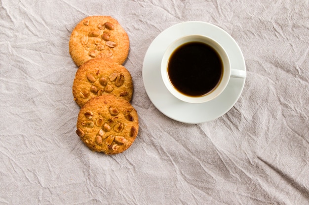 Cup of black coffee and cookies