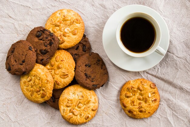 Cup of black coffee and cookies  