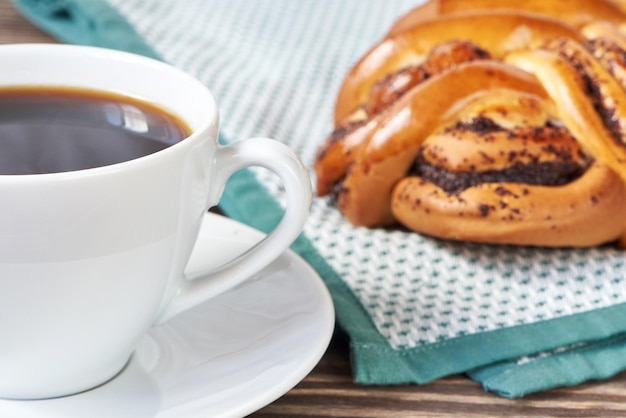 Cup of black coffee and poppy seed cake