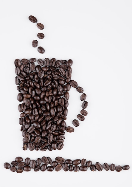 Cup of black coffee shape created from beans on white background