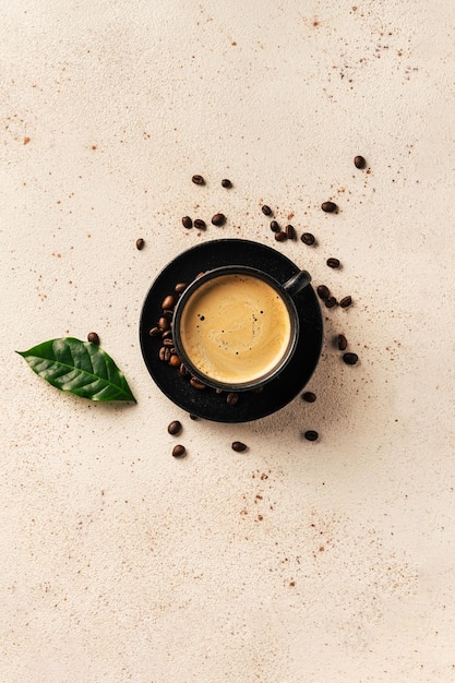 Cup of black crema coffee on light background top view Cafe and bar barista art concept Copy space