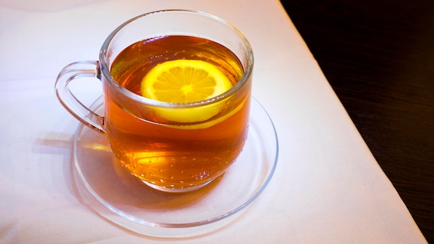 Cup of black tea with lemon