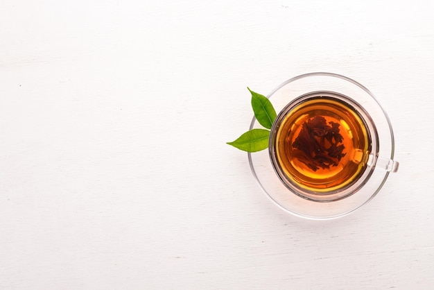 A cup of black tea on a wooden background Top view Copy space