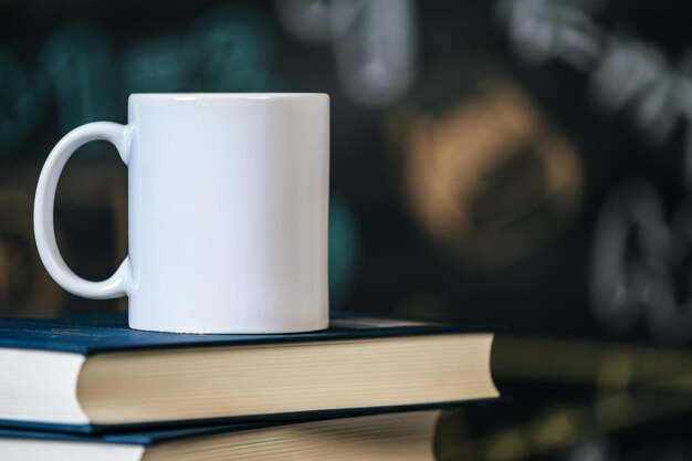 cup on the books in classroom