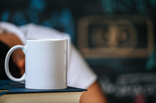 cup on the books in classroom