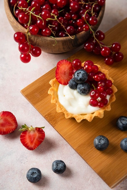 Cup cakes with composition on white backround mixed fruits