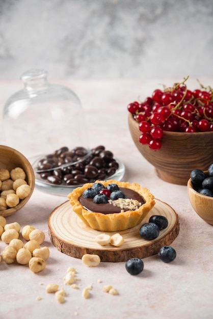 Cup cakes with composition on white backround mixed fruits