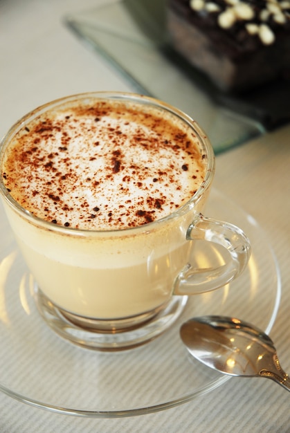 Cup of cappuccino and brownies