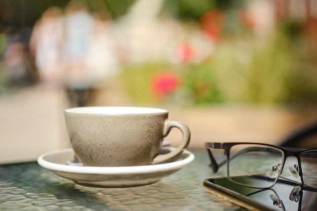 Cup of cappuccino on caffe terrace table