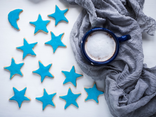 Cup of cappuccino and fresh festive cookies