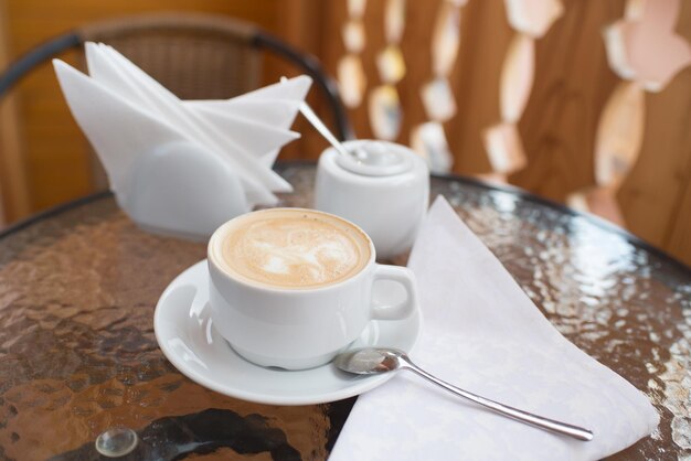 A cup of cappuccino in the hotel room